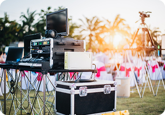 Outdoor event sound and broadcast equipment set up at sunset